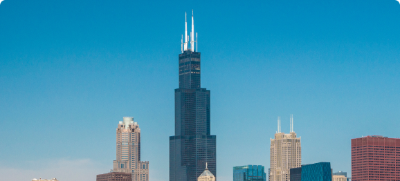 The Willis Tower in Chicago against a blue sky.